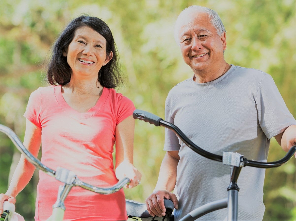elderly-asian-couple-with-bikes