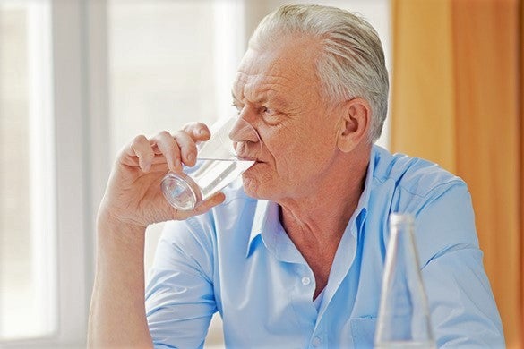 elderly-man-with-dysphagia-drinking-water