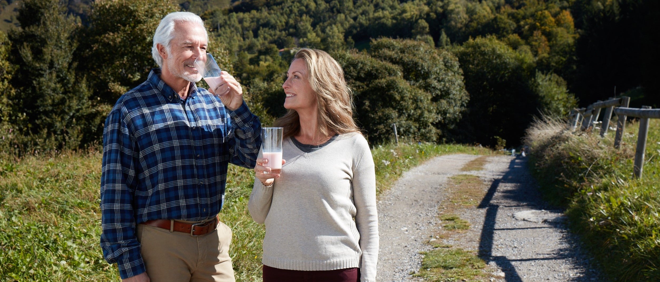 elderly-couple-drinking-in-nature