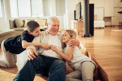 man sitting with children