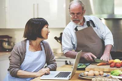 men and woman cooking